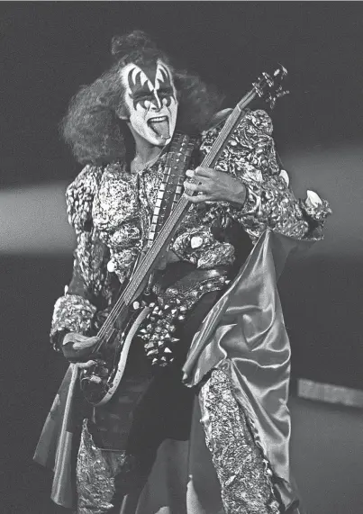  ?? THE COMMERCIAL APPEAL FILE ?? KISS hit the Mid-south Coliseum on Aug. 12, 1979, and Memphians came out in full force to embrace the rock band. Every one of the 11,999 seats was taken, and even those fans seated behind the stage paid $10 each. Guitarist Gene Simmons gave fans what they wanted.