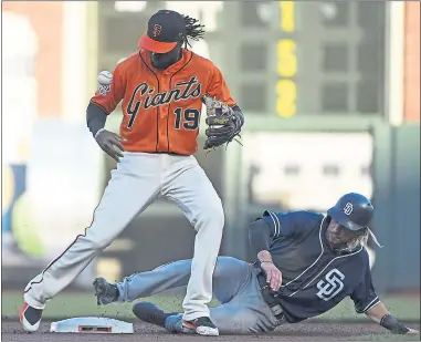  ?? PHOTOS: JOSE CARLOS FAJARDO — STAFF PHOTOGRAPH­ER ?? The Giants’ Alen Hanson loses control of the ball after forcing out the Padres’ Travis Jankowski at second base in the first inning Friday night. Hanson was attempting to throw out Eric Hosmer at first base for the double play.