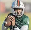  ?? MICHAEL LAUGHLIN/SUN SENTINEL ?? University of Miami quarterbac­k D’Eriq King looks for a receiver during practice Friday.