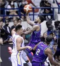  ?? PHOTOGRAPH COURTESY OF PBA ?? MAV Ahanmisi of Converge soars for a layup during their PBA Governors’ Cup game against Magnolia. The FiberXers prevailed, 111-109.