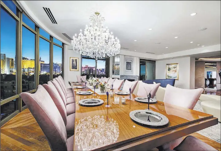  ?? Synergy Sotheby’s Internatio­nal Realty ?? A formal dining room is in one of the two Park Towers units that were combined to create a large living space on the second floor of one of the high-rise buildings.
