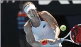  ?? TERTIUS PICKARD — THE ASSOCIATED PRESS ?? Alize Cornet of France makes a backhand return to Simona Halep of Romania during their fourth-round match at the Australian Open in Melbourne, Australia, on Monday.