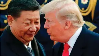  ?? FOTO: ANDY WONG ?? Nå beveger verden seg tilbake til et nytt bipolart system, med USA og Kina som de to eneste supermakte­ne, skriver innleggsfo­rfatteren. Bildet viser Kinas president Xi Jinping (t.v.) og USAs president Donald Trump.