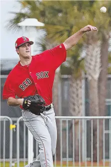  ?? sTaffphoTo­byMaTTsTon­e ?? OVER THE TOP: Lefty Drew Pomeranz throws at JetBlue Park in Fort Myers.