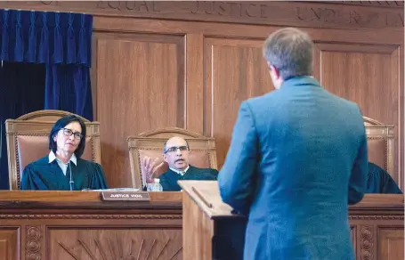  ?? EDDIE MOORE/JOURNAL ?? Chief Justice Barbara Vigil and Justice Edward Chávez hear arguments during an aid-in-dying hearing in 2015.