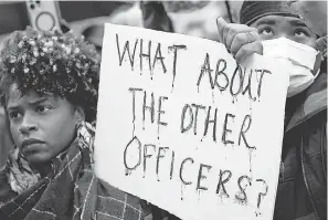  ?? GERALD HERBERT/ AP ?? Protesters march last month in Memphis, Tennessee, over the death of Tyre Nichols, who died after being beaten by police officers during a traffic stop.