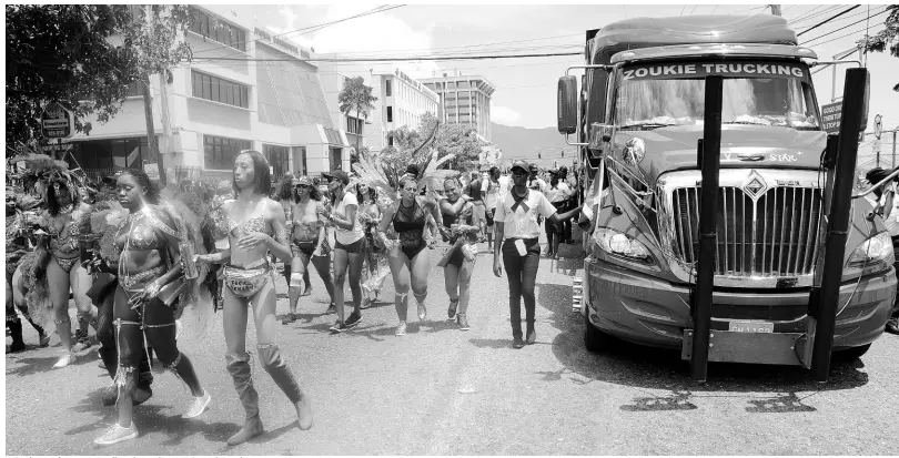  ?? SHORN HECTOR/PHOTOGRAPH­ER ?? A Zoukie truck among revellers during last year’s road march.