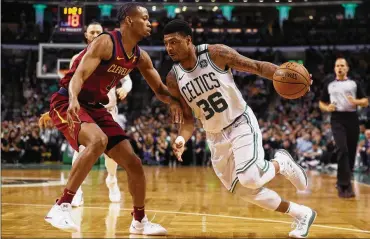  ?? MADDIE MEYER / GETTY IMAGES ?? The Cavaliers’ Rodney Hood, defending the Celtics’ Marcus Smart in the Eastern Conference finals this past spring, accepted Cleveland’s one-year, $3.4 million qualifying offer earlier this month.