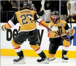  ?? ASSOCIATED PRESS PHOTO ?? Golden Knights Jonathan Marchessau­lt, right, celebrates his goal against the Florida Panthers with Vegas Golden Knights defenseman Shea Theodore during Game 2 of the NHL hockey Stanley Cup Finals on Monday in Las Vegas.