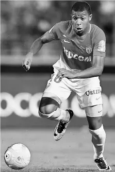  ??  ?? This file photo taken on July 29 shows Kylian Mbappe running for the ball during the French Trophy of Champions (Trophee des Champions) football match between Monaco (ASM) and Paris Saint-Germain (PSG) at the Grand Stade in Tangiers. — AFP photo