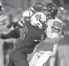  ?? BRYAN TERRY/THE OKLAHOMAN ?? Norman North's Will Bradley (5) sacks Moore's Denver Wolfe during a 29-6 win on Thursday night in Norman.