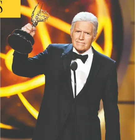  ?? ALBERTO E. RODRIGUEZ / GETTY IMAGES ?? Alex Trebek, accepting the Daytime Emmy Award for Outstandin­g Game Show Host in 2008,
was an officer of the Order of Canada and a philanthro­pist with World Vision.