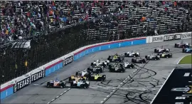  ?? ASSOCIATED PRESS ARCHIVES — 2019 ?? Drivers jockey for position at the start of an last year’s race at Texas Motor Speedway. IndyCar is getting ready for an all-in-one-day season opener on the fast track in Texas.