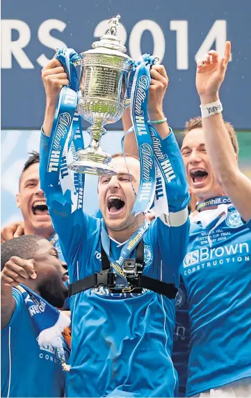  ??  ?? CAPTAINS FANTASTIC: St Johnstone skipper Jason Kerr lifts the League Cup after Sunday’s win over Livingston, left, while Dave Mackay holds aloft the Scottish Cup following victory over Dundee United in the final in 2014.