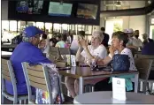  ??  ?? Baseball fans gather in the Bullpen Club at George M. Steinbrenn­er Field before a spring training exhibition baseball game between the New York Yankees and the Toronto Blue Jays in Tampa, Fla., on March 24.