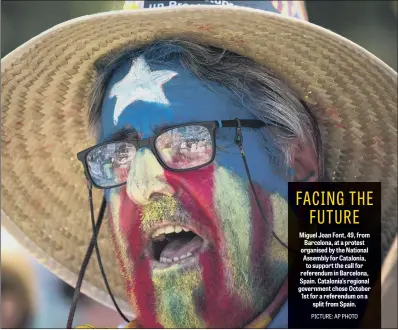  ??  ?? Miguel Joan Font, 49, from Barcelona, at a protest organised by the National Assembly for Catalonia, to support the call for referendum in Barcelona, Spain. Catalonia’s regional government chose October 1st for a referendum on a split from Spain.