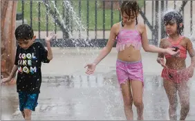  ?? ?? The Associated Press
Children cool off in a water park in this file photo. The City of Kelowna has just released its summer actiivity and program guide.