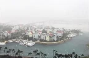  ??  ?? Storm clouds form a haze around The Bahamas capital of Nassau in this October 6, 2016 photo. The Bahamas is currently under a cloud with plans by the European Union to consider blacklisti­ng the country as a tax haven later this week.