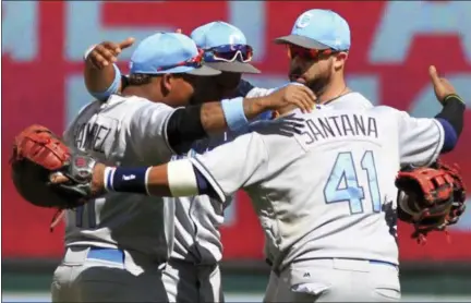  ?? ANDY CLAYTON-KING — THE ASSOCIATED PRESS ?? Carlos Santana (41), Jose Ramirez (11), Bradley Zimmer (4) and Lonnie Chisenhall celebrate after defeating the Twins, 5-2, on June 18 in Minneapoli­s.