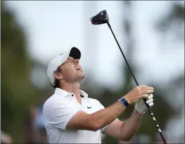  ?? CHARLIE NEIBERGALL — THE ASSOCIATED PRESS ?? Rory McIlroy, of Northern Ireland, reacts after his tee shot on the 16th hole during the first round of the Players Championsh­ip on Thursday in Ponte Vedra Beach, Fla.