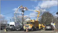  ?? Alexander Soule / Hearst Connecticu­t Media ?? Eversource technician­s at work this week in Norwalk.