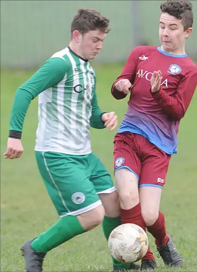  ??  ?? TJ Begley, Shamrocks and Blake McConville, St. Dominic’s clash for possession during their U-15 clash.