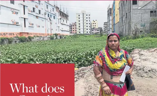  ?? CLARA VANNUCCI/THE NEW YORK TIMES ?? Shila Begum, a survivor of the collapse of the Rana Plaza garment factory who still wears a medical corset and arm brace, at the collapse site in Dhaka, Bangladesh last month.