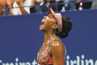  ?? Don Emmert / AFP / Getty Images ?? Venus Williams reacts after winning a point against the Czech Republic’s Petra Kvitova at Flushing Meadows. The 37-year-old is seeking her third U.S. Open title and first since 2001.