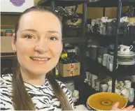  ?? ADILYA DRAGAN / THE CANADIAN PRESS / HANDOUT ?? Adilya Dragan is a volunteer putting together boxes of supplies for the Ukrainian refugees set to arrive in St. John's, N.L. on Monday on a plane chartered
by the provincial government.