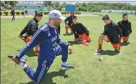  ?? XU JINGXING / CHINA DAILY ?? An Argentine soccer coach trains young Chinese players, affiliated with Beijing Sport University, in Buenos Aires, Argentina, on Sunday.