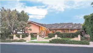  ?? ANTHONY BARCELO/ERNIE CARSWELL & PARTNERS VIA THE ASSOCIATED PRESS ?? The home in The Brady Bunch opening and closing scenes is up for sale for first time in 45 years.