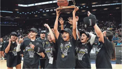  ?? ROB SCHUMACHER/THE REPUBLIC ?? Legendary Elite celebrates after defeating Quiet Storm in the girls championsh­ip game for the Native American Basketball Invitation­al at Footprint Center in Phoenix on July 23, 2023.