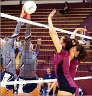  ?? Photo by Randy Moll ?? Gentry’s Yuliana Stasiv and Hannah Boss attempt to block a tip over the net by Shiloh Christian players.