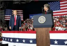  ?? Carolyn Kaster/AP ?? President Donald Trump listens to Fox News’ Sean Hannity speak during a rally in Cape Girardeau, Mo., on Nov. 5.