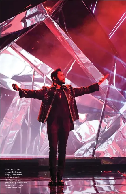  ??  ?? With a futuristic stage—featuring a huge, illuminate­d star overhead— the Weeknd (seen performing in London) proves why his star continues to rise.