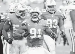  ?? AP FILE PHOTO ?? Dolphins veteran DE Cameron Wake (91) is eager to compete in his first playoff game.