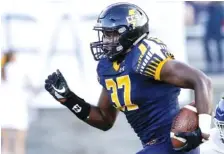  ?? STAFF PHOTO BY C.B. SCHMELTER ?? Chattanoog­a Christian’s TreVeon Scott carries the ball during the Chargers’ home game against Boyd Buchanan on Sept. 20. The Chargers hosted a playoff game for the first time last week and won in a rout.