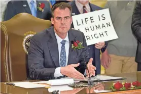  ?? SUE OGROCKI/AP FILE ?? A provision in an abortion ban passed by Oklahoma’s Legislatur­e on Thursday states the law begins as soon as Gov. Kevin Stitt signs it.