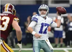  ?? Associated Press ?? ■ In this Jan. 3, 2016, file photo, Washington Redskins outside linebacker Trent Murphy (93) applies pressure on Dallas Cowboys quarterbac­k Kellen Moore (17) during the first half of an NFL football game in Arlington, Texas. Two years ago, Moore went into training camp as the backup to Tony Romo before breaking an ankle in practice. Because of that injury, Prescott became the starter when Romo injured his back in a preseason game.