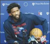  ?? Associated Press ?? Philadelph­ia 76ers center Joel Embiid speaks with members of the media at the NBA basketball team’s practice facility, Feb. 29, in Camden, N.J.