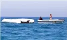  ??  ?? A Libyan coastguard vessel drags a deflated rubber boat after the craft sank off Garabulli on 10 June 2017. Photograph: Mahmud Turkia/AFP/Getty
