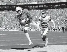  ?? Tim Warner/Getty Images ?? Texas and OU will still face off annually when they join the SEC, which is mulling an eight- or nine-game league schedule.