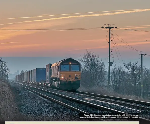  ?? MARTYN FORDHAM ?? Above: A DB Schenker-operated container train, with 66030 in charge, passing Little Downham near Ely on December 11, 2010.