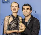  ?? BILD: SN/JORDAN STRAUSS/INVISION/AP ?? Diane Kruger und Trophäe. Fatih Akin mit