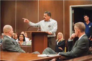  ??  ?? Cathy Torrez's brother Marty Torrez directs his personal impact statement comments as Deputy District Attorney Matt Murphy, right, and investigat­or Daron Wyatt listen in Santa Ana.