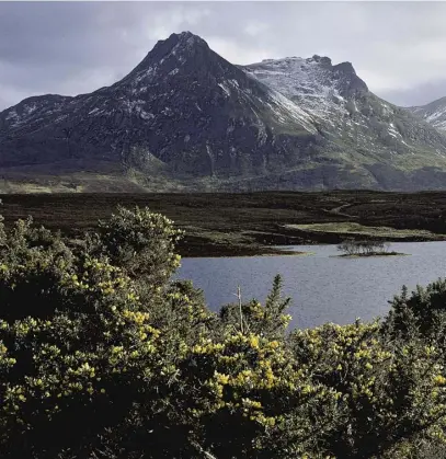  ??  ?? Ben Loyal seen from Lochan Hakel, main; Alfred Wainwright in the shadow of Ben Hope, right; Richard Else, film maker and friend of Wainwright, inset left; his book Wainwright
Revealed, below