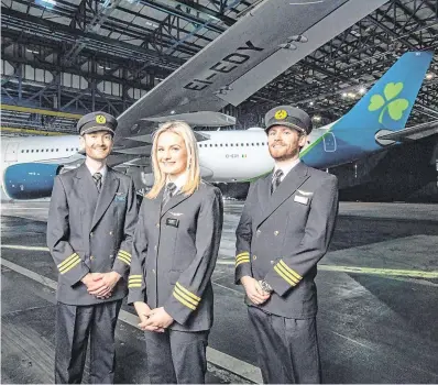  ?? PHOTO: NAOISE CULHANE ?? Jet set: First Officers Niall McCauley, Laura Bennett and Paul Deegan at the unveiling of the new livery.