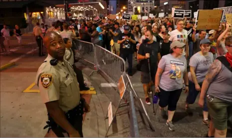  ??  ?? Protesters rally in downtown St. Louis as fans arrive for a Billy Joel concert at Busch Stadium on Thursday. The protest was the latest of several since a judge on Friday announced a not-guilty verdict for a white former St. Louis police officer...