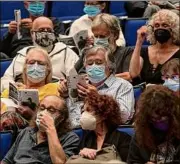  ??  ?? Lori Van Buren / Times Union
People are masked up Thursday before a show at The Egg at the Empire State Plaza in Albany.