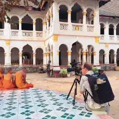  ?? COURTESY OF REDCOATES STUDIOS ?? Jerry Redfern films monks in Laos for the documentar­y, “Eternal Harvest.”